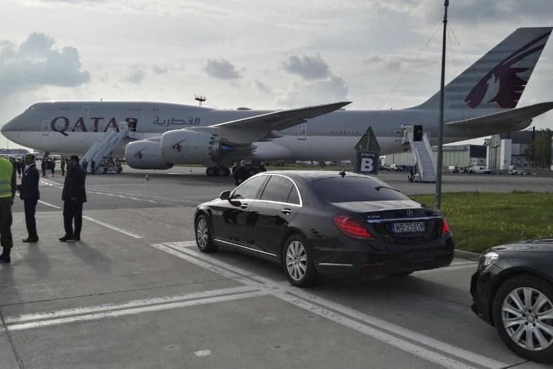 VIP car in Poland. Limousine parked in front of the big airplane. VIP service for events and conferences. Chauffeured limousines for rent.